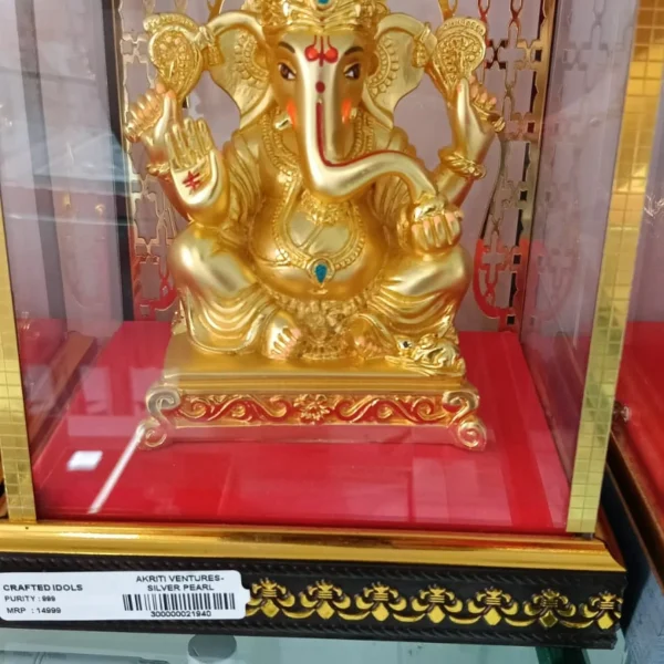 999 silver crafted Idol seated majestically on an ornate platform with a premium two tone gold finish